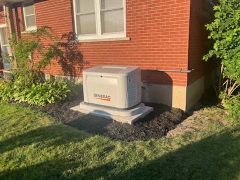 Generac standby generator installed beside a client's home
